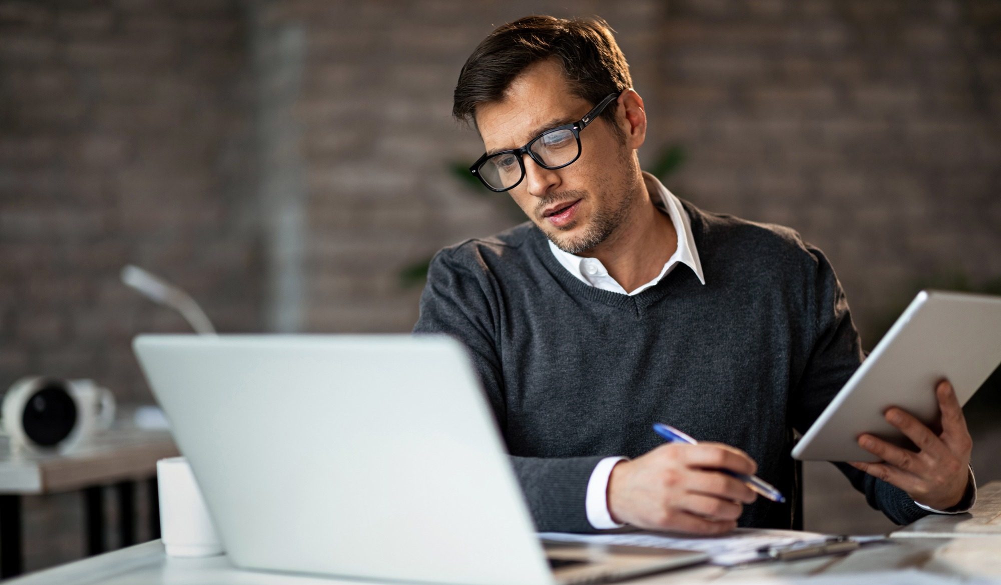 A man looking at the laptop
